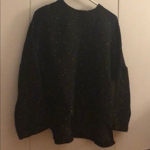 Black sweater with gold woven stitching